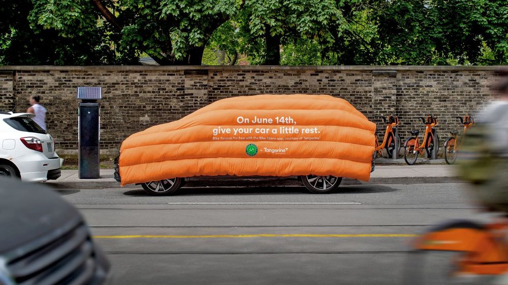 Tangerine Bike For Free Day - orange duvet on car